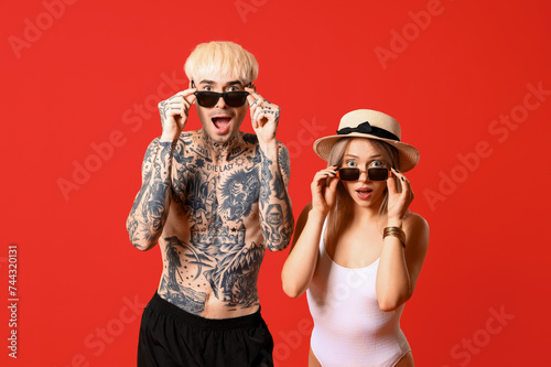 Shocked young couple in sun...