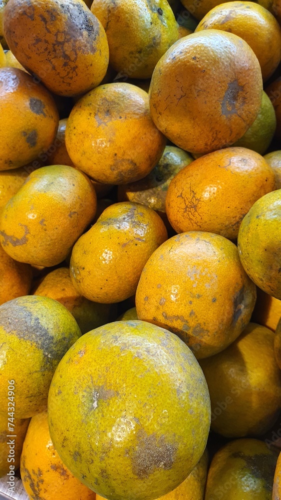 Close up pile of tasty fresh oranges sold at the market as a background. Close up pile of tasty fresh oranges sold at the market as a background.