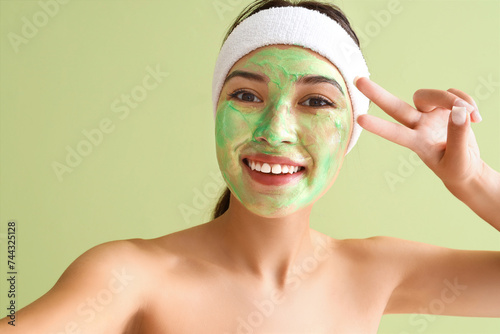 Smiling young woman with gr...