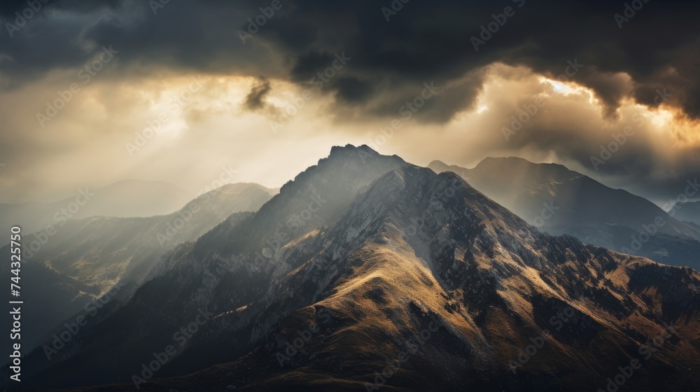 Mountain ridge with a dramatic and cloudy sky