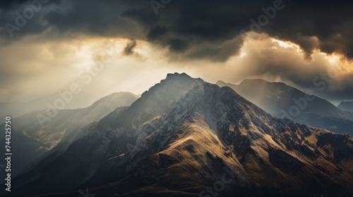 Mountain ridge with a dramatic and cloudy sky © stocksbyrs