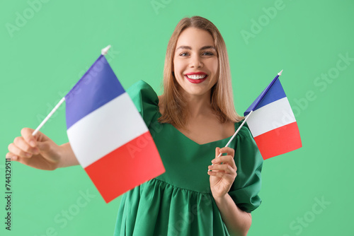 Young woman with flags of F...
