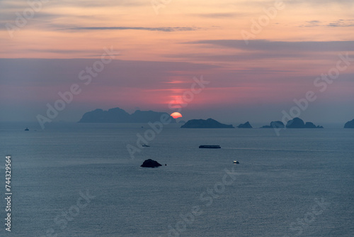 View of the sunrise with islands and clouds