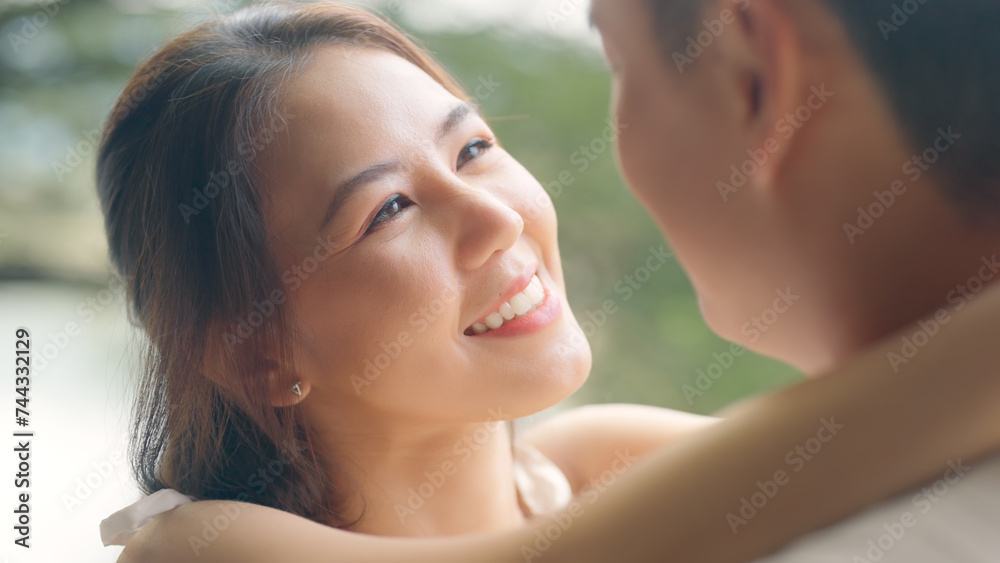 Sweet lovers arm around shoulder hug neck face to face talking at outdoor nature. Trust true love smile happy asia people in casual bride groom white dress begin family life just married young couples
