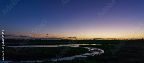 View at small lake on the atlantic coast near Praia da Ponta da Areia beach during evening twilight, Vila Real Santo Antonio, Algarve, Portugal
