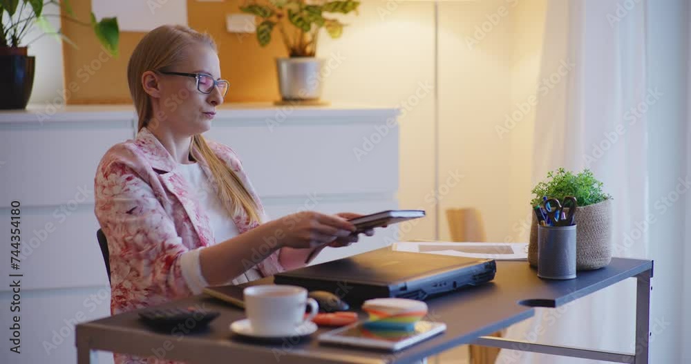 Tired businesswoman reading strategy from diary Tired businesswoman reading strategy from diary