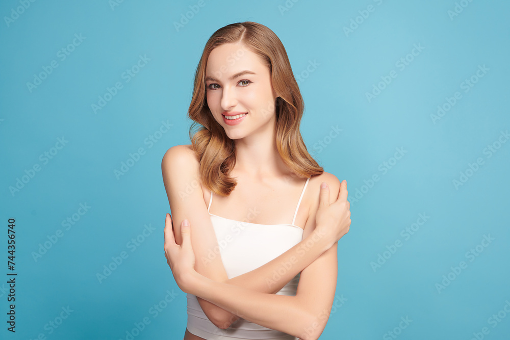 Beautiful young woman with clean fresh skin on blue background, Face care, Facial treatment, Cosmetology, beauty and spa, women portrait. Beautiful young woman with clean fresh skin on blue background, Face care, Facial treatment, Cosmetology, beauty and spa, women portrait.