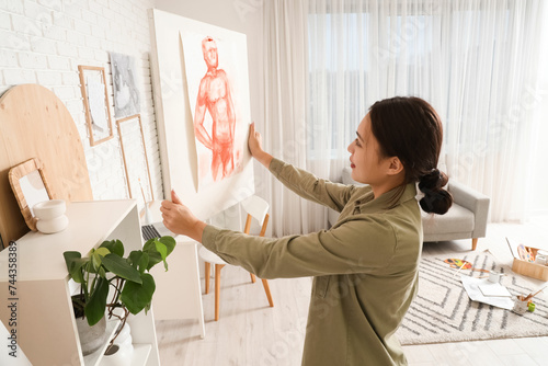 Female Asian artist with pa...
