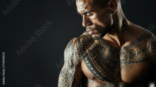 Patterns and designs adorn the muscular and athletic body of a man’s, showcasing a Polynesian-style tattoo with skin painting