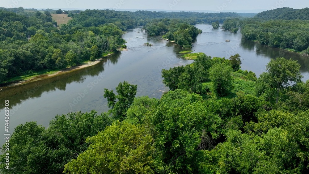 Potomac river gently flowing in peaceful countryside in Maryland, Virginia state line