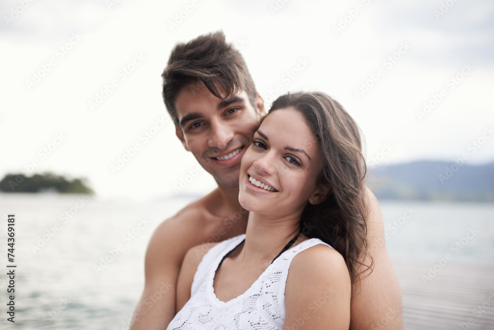 Portrait, smile and couple at sea on vacation, holiday or travel together outdoor in Italy. Face, man and happy woman at ocean for adventure, care and connection in summer by water in nature for love