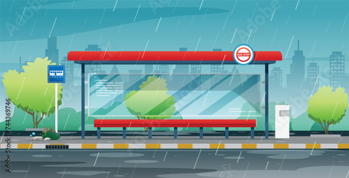 It's raining at the bus stop with the city in the background.