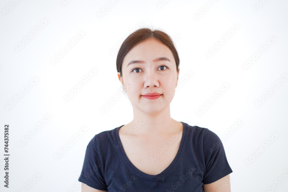 Smart and good looking Asian beautiful young woman in dark blue color t-shirt portrait. Smart and good looking Asian beautiful young woman in dark blue color t-shirt portrait.