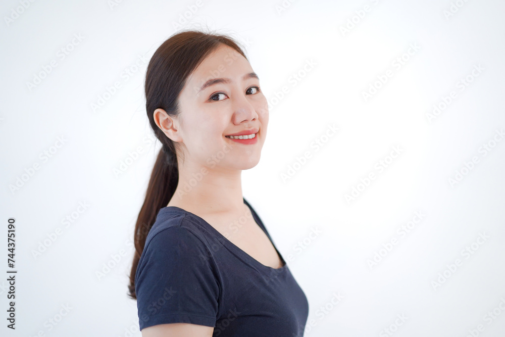 Smart and good looking Asian beautiful young woman in dark blue color t-shirt portrait. Smart and good looking Asian beautiful young woman in dark blue color t-shirt portrait.