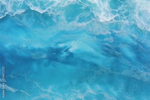 Aerial view of ripple sea waves. Blue sea texture with waves. Water sea or ocean for background © alisaaa