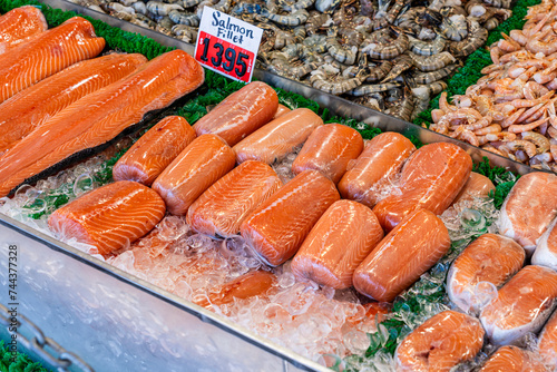 Fresh salmon fillets on fish stand in fish market at the Wharf Washington D.C