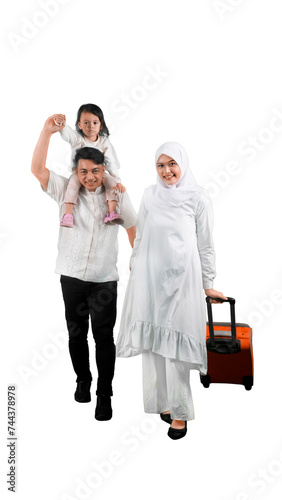Happy muslim family of three walking with a suitcase