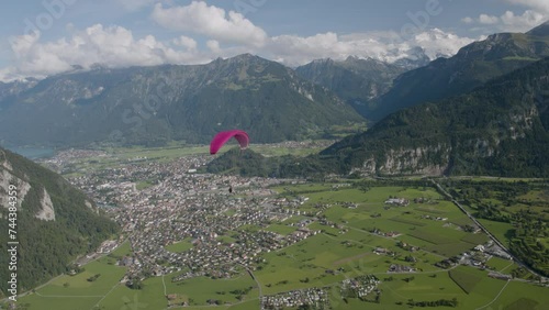 Paraglider over Switzerland city - Epic drone shot
