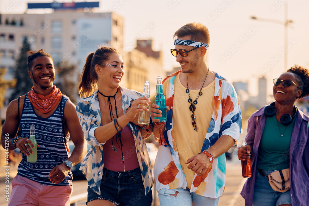 Happy couple toasting while going on summer music festival. Happy couple toasting while going on summer music festival.