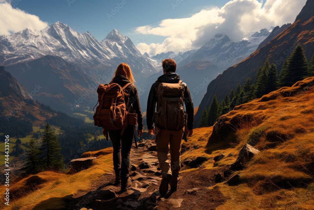 Man and a woman hiking in the mountains in autumn