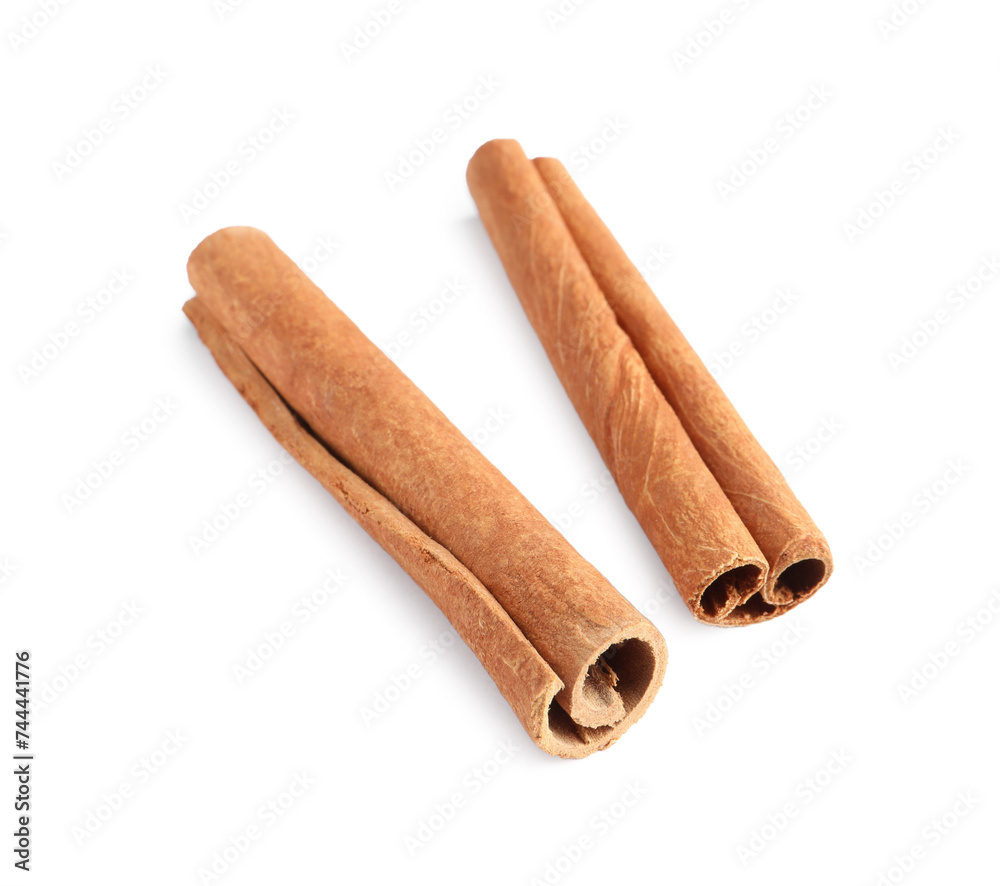 Two aromatic cinnamon sticks isolated on white Two aromatic cinnamon sticks isolated on white