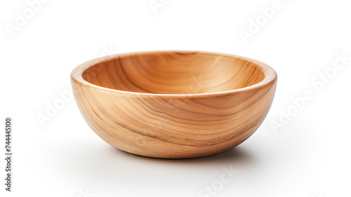 A wooden dish set up on a stark white background