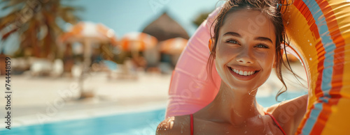 A joyful, lively, and attractive young woman with a slim figure is wearing a ...