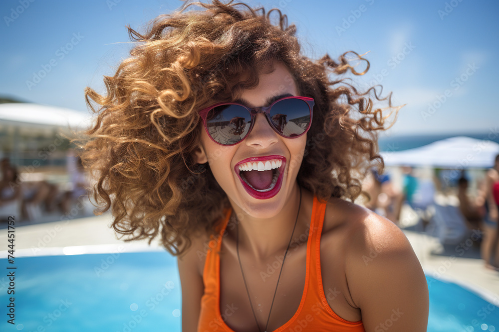 Happy woman laughing in a public swimming pool