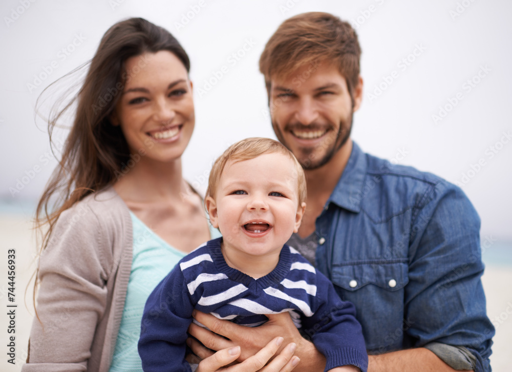 Mother, father and portrait with toddler at beach for family, love and adventure together on vacation. Happy, man and woman with baby by ocean for support, travel and relaxing holiday in Los Angeles Mother, father and portrait with toddler at beach for family, love and adventure together on vacation. Happy, man and woman with baby by ocean for support, travel and relaxing holiday in Los Angeles