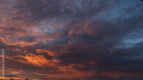 Dramatic sunset with vibrant clouds lit by a sun © GCapture