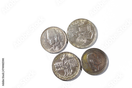 Background of Egyptian silver coins of Orabi revolution, President Gamal Abdel Nasser, king Farouk I and the golden Jubilee of the Arab league, old vintage retro silver coins of different times photo