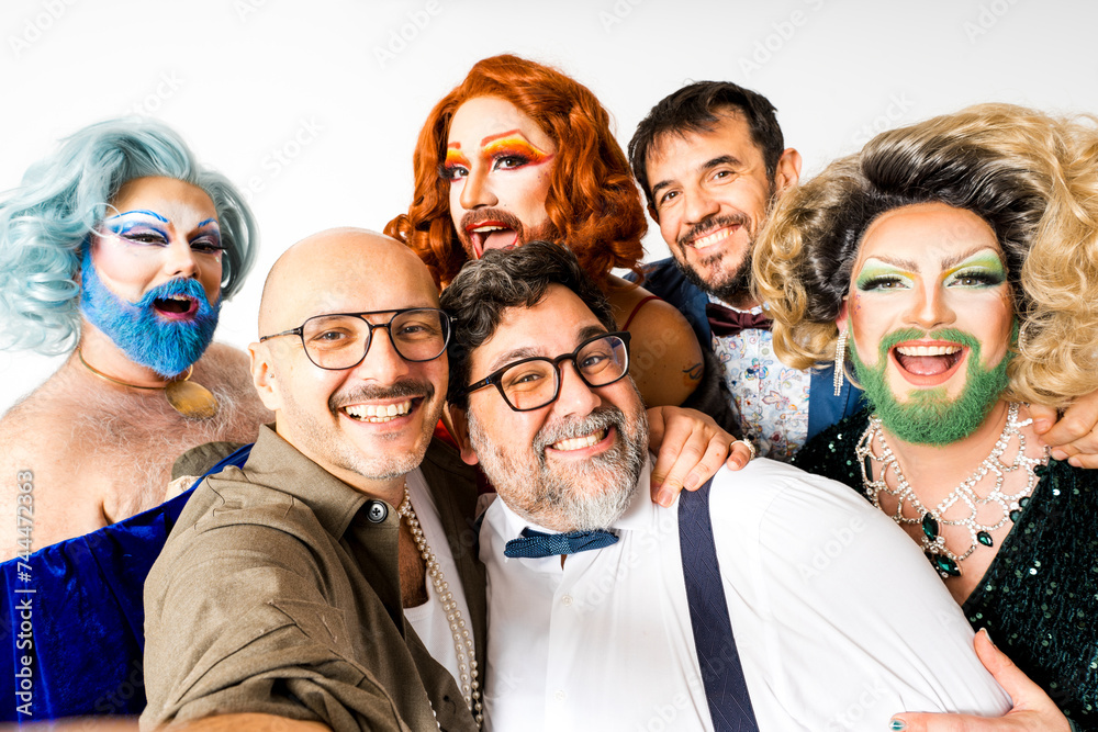 POV of group of cheerful drag queens with diverse men taking a selfie POV of group of cheerful drag queens with diverse men taking a selfie