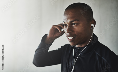 Man, face and music for fitness outdoor with thinking, listening to podcast and happiness for healthy body. Athlete, african person and earphones with audio, radio and sound for workout and mockup