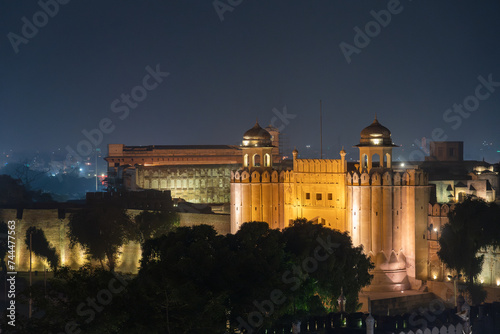 Night cityscape view on illuminated white Alamgiri gate built by mughal emperor Aurangzeb as entrance to Lahore fort, a UNESCO World Heritage site, Punjab, Pakistan photo