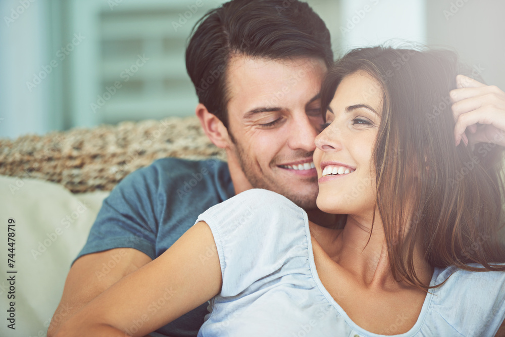 Happy, love and couple relaxing on sofa for bonding in living room at apartment together. Smile, resting and young man and woman laying on couch for romance and marriage in lounge at modern home. Happy, love and couple relaxing on sofa for bonding in living room at apartment together. Smile, resting and young man and woman laying on couch for romance and marriage in lounge at modern home.