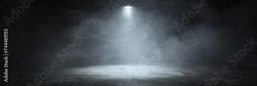 A dark room with a concrete floor and a spotlight. Suitable for dramatic or mysterious themed designs, theater and event promotion, and creative storytelling visuals. empty dark blue room	