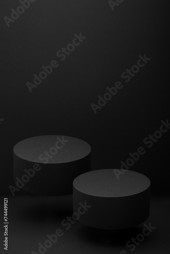 Two black round podiums levitate, set, mockup on black background, shadow. Template for presentation cosmetic products, gifts, goods, advertising, design, display, showing in rich black friday style.