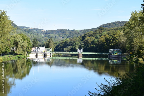 mirror calm reservoir of river Our / Sauer with the dam