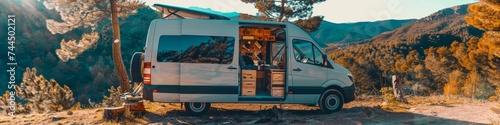 Adventure Van Life - A van parked with a scenic backdrop, open to reveal a cozy, converted interior for living on the road. 