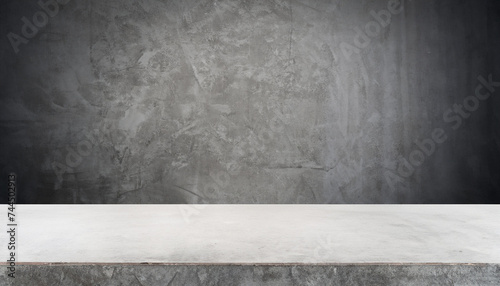 Empty exposed concrete table and wall background, interior backdrop for product display. studio room
