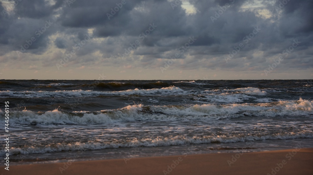 sea and beach in the color of the setting sun