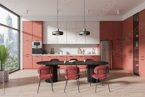 White and pink kitchen interior with dining table