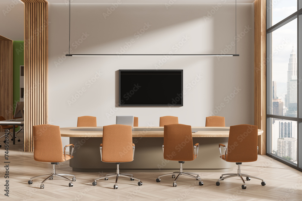 Cozy meeting interior with table and chairs, tv display and panoramic window Cozy meeting interior with table and chairs, tv display and panoramic window