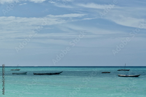 Scenic view of moored boats at Jambiani beach  Zanzibar