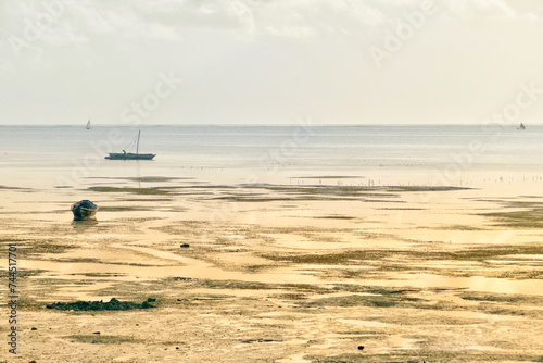 Scenic view of moored boats at Jambiani beach, Zanzibar photo