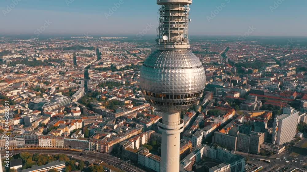 BERLIN, GERMANY - JUNE 16, 2023: Aerial drone view shot of TV Tower on the main square in city center from above at sunny day.