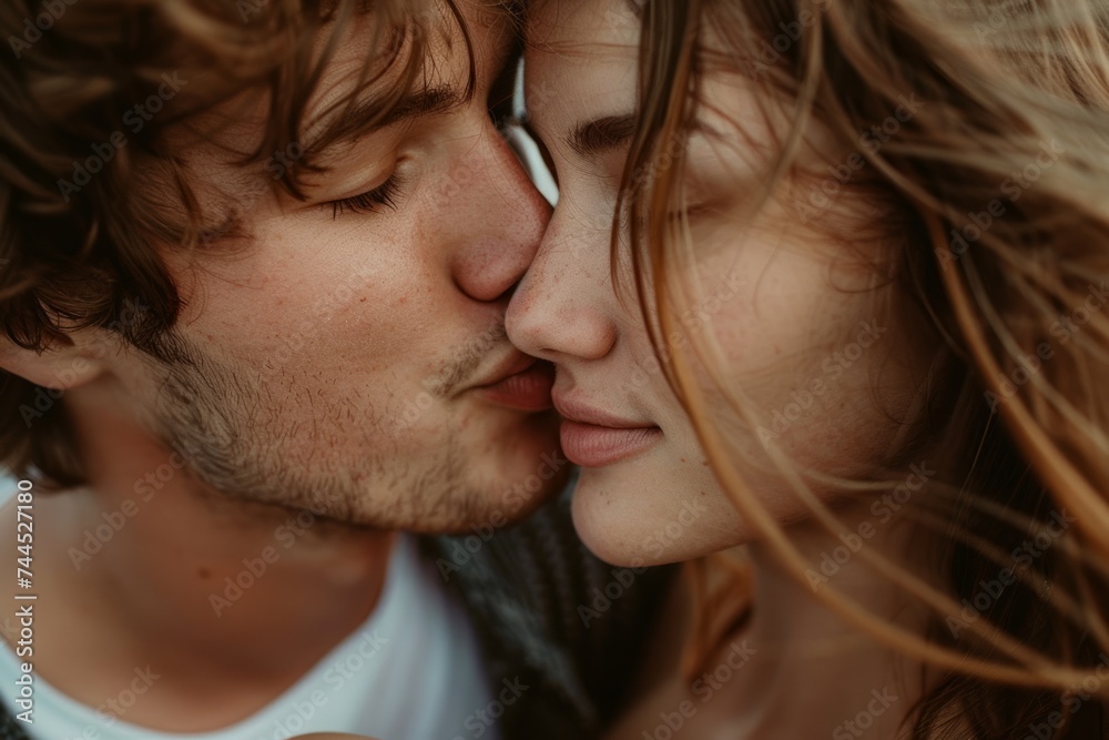 A couple kissing showing a tender moment between them in a close up shot, cute kiss photo A couple kissing showing a tender moment between them in a close up shot, cute kiss photo