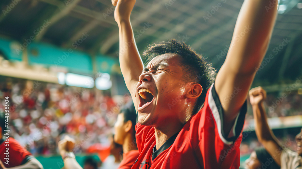 A joyful fan shouts joyfully in the stands A joyful fan shouts joyfully in the stands
