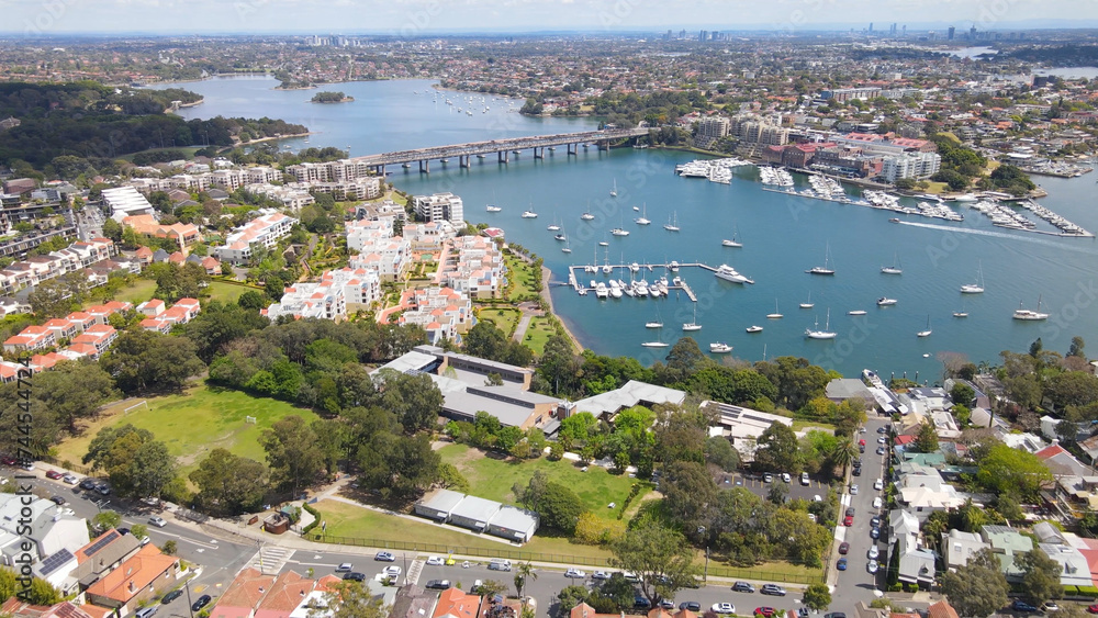 Aerial drone view over Balmain in Sydney, New South Wales, Australia looking toward Sommerville Point and Birkenhead Point on a sunny day    