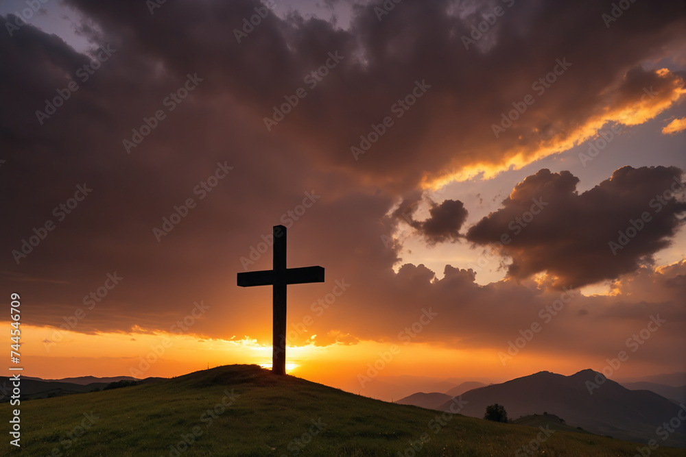 Sunset behind cross in epic landscape